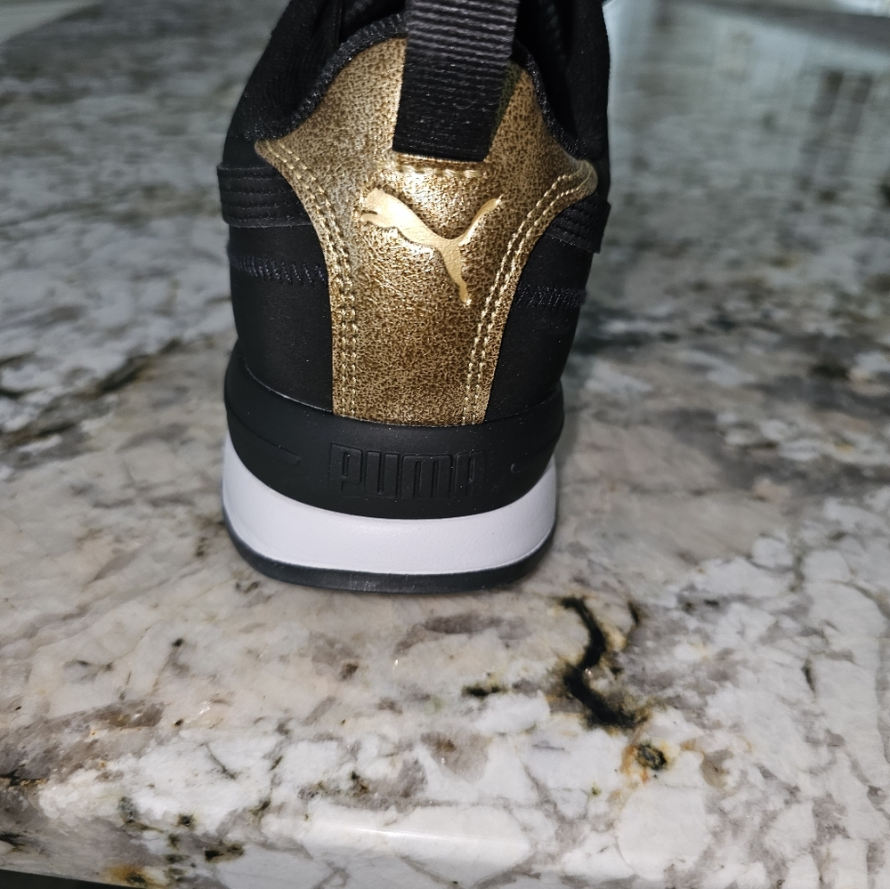 Puma sneakers, size 11,women's, original price 85.00. One black pair and 1 white